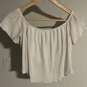 White, flowy, off the should crop top. Lightly worn. Easily wrinkles.